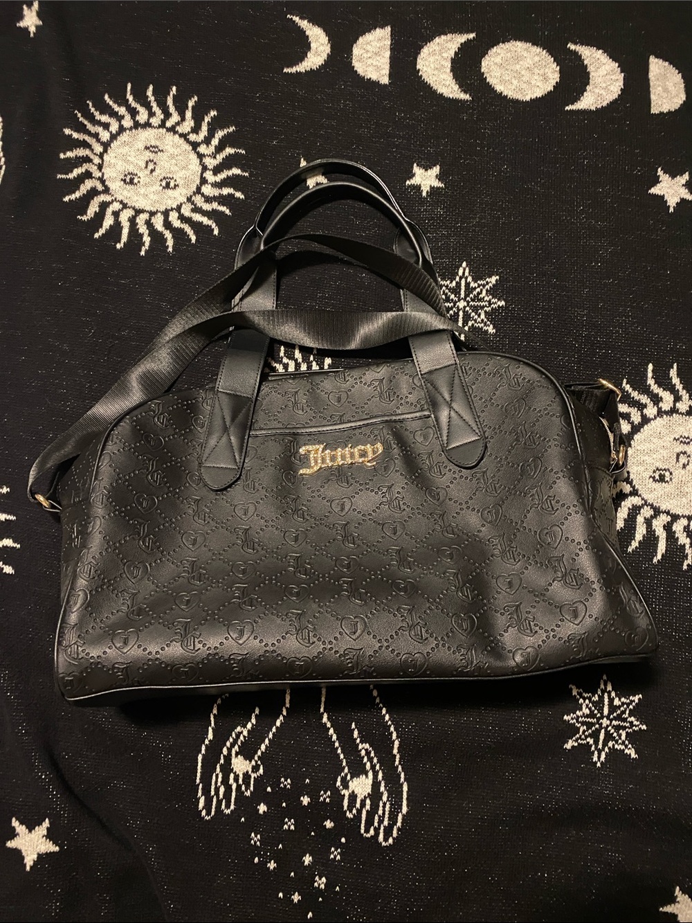 Juicy couture black leather logo embossed duffle bag